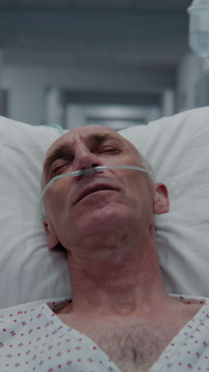 Patient with breathing tube tries to sleep on gurn 4k 2025 08 04 05 46 43 utc.mov | african american, breathing tube, care, caucasian