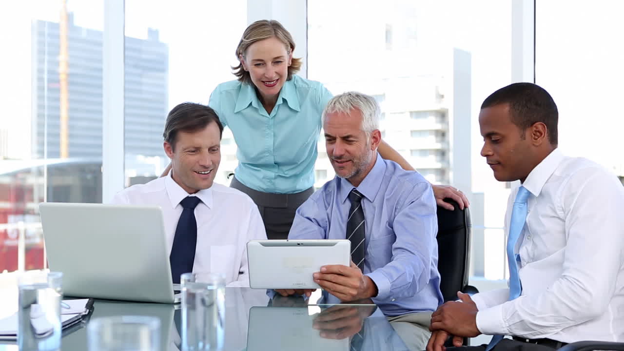 Group of business people using laptop and tablet computer