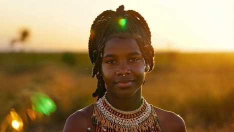 portrait of a young african woman with braids and jewelry