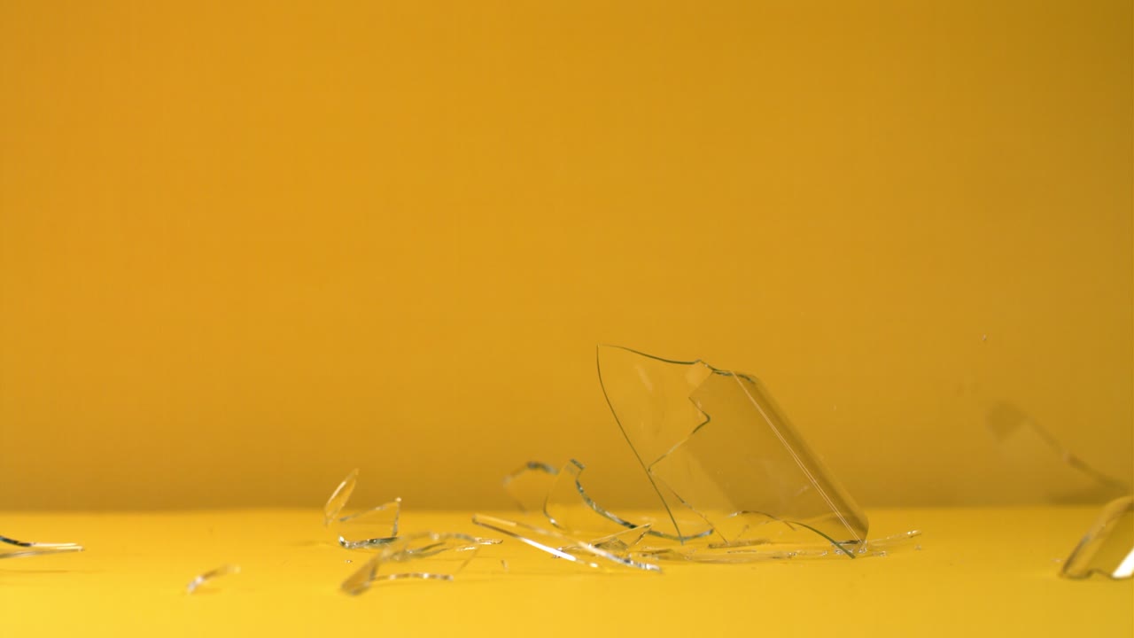 Broken Glass on Yellow Background