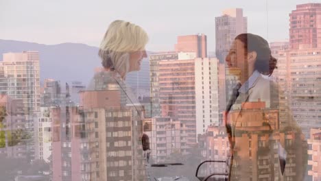 animation of businesswomen handshake over cityscape