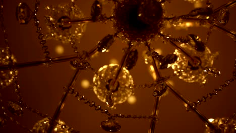 crystal and diamonds wall chandelier texture. beautiful low angle track shot of a luxury wall chandelier. close up