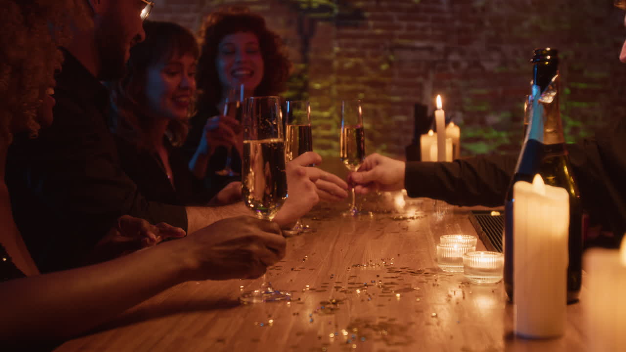 Group of people celebrating with drinks at a bar