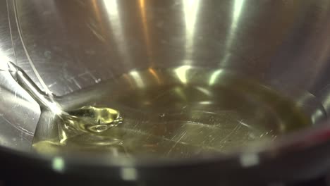 slow motion shot of hot oil being prepared for frying