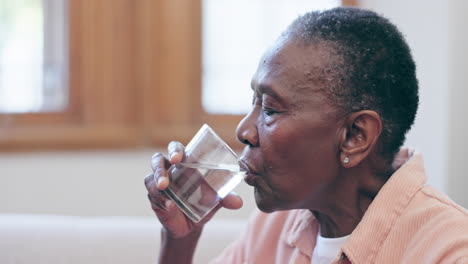 pills, glass and water for a black woman