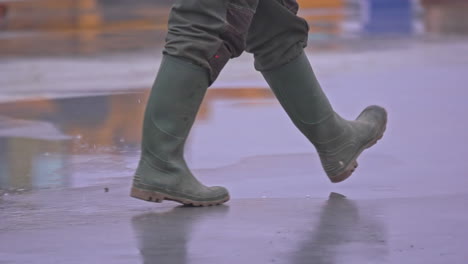 legs in green camouflage wellies or work boots