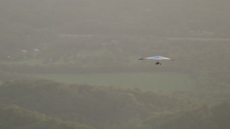 hang glider flight in distance telephoto shot