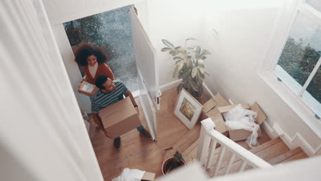 Real-estate,-box-and-couple-moving-into-new-house