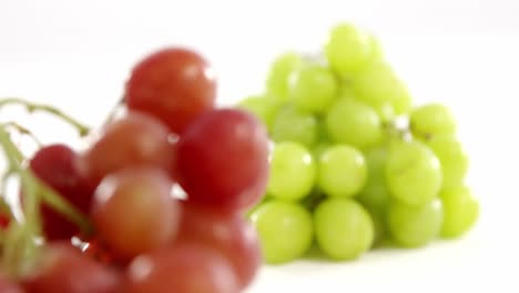 Close-up-of-green-and-red-bunches-of-grapes