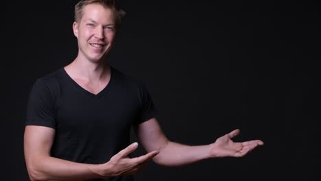 happy man showing copy space with hands