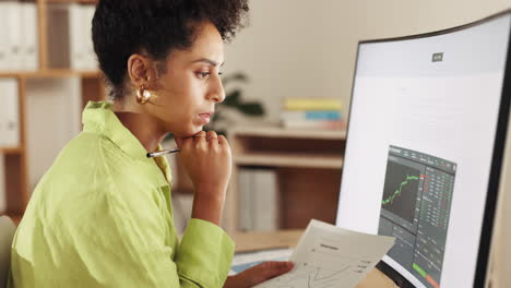 Office,-woman-at-desk-and-computer-with-charts