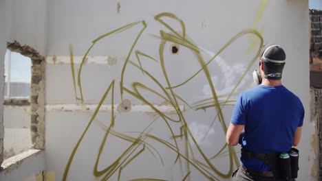 Graffiti-artist-looking-at-the-wall-4k