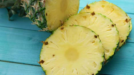 slices of pineapple on blue wood