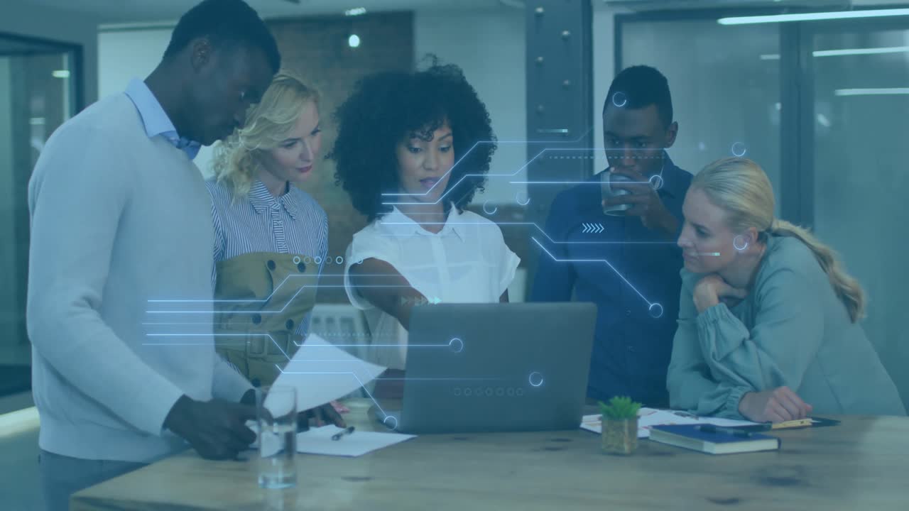 Curly-haired leader pointing laptop data stream, guiding team reviewing reports in business pitch