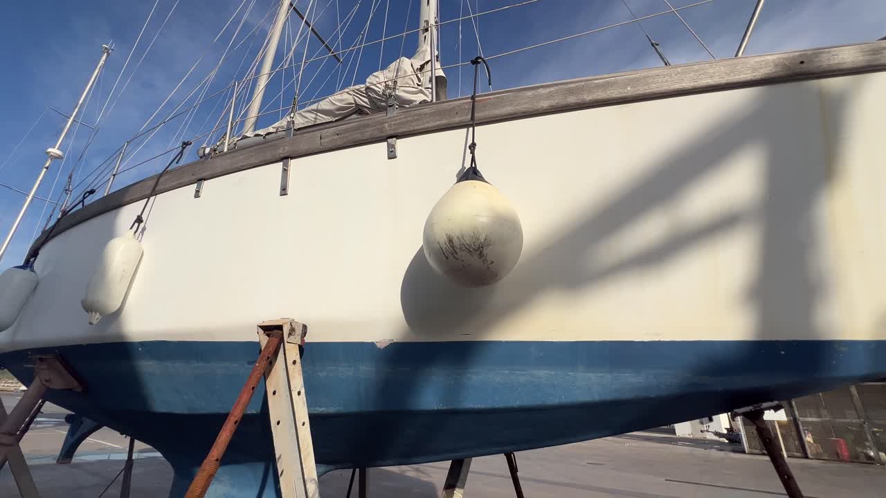 Close-up boat is standing on a stand in the harbor