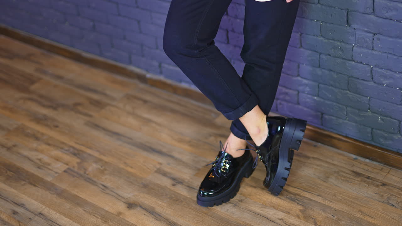 Woman in Black Platform Shoes and Pants