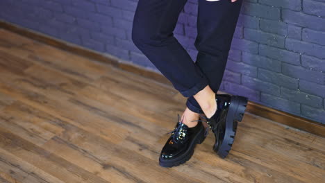 woman in black platform shoes and pants