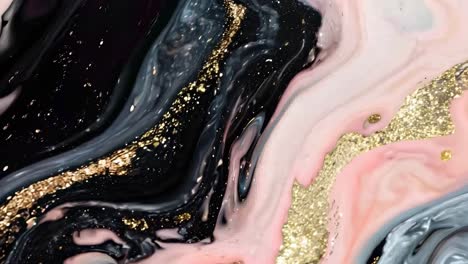 abstract art with swirling black, pink, and gold textures, captured from a top-down angle