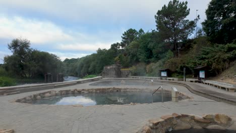 establishing shot of muiño da veiga thermal baths in ourense, galicia, spain