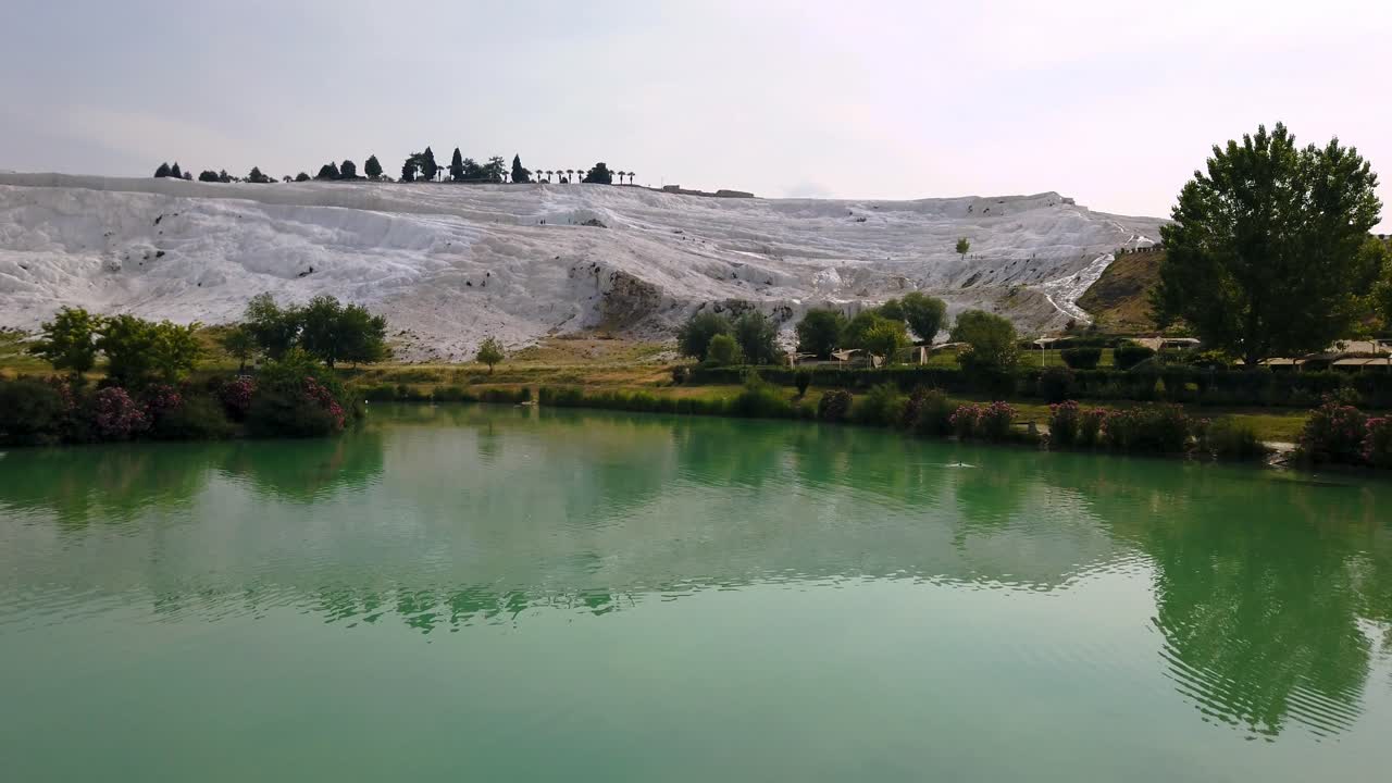 Pamukkale, meaning "cotton castle" in Turkish, is a natural site in Denizli in southwestern Turkey. The area is famous for a carbonate mineral left by the flowing water.