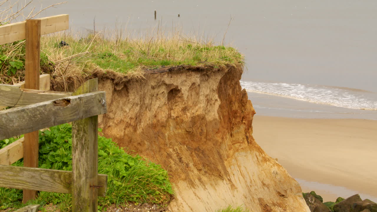 Mid shot of coastal erosion of the cliffs at Happisburgh in March 2024