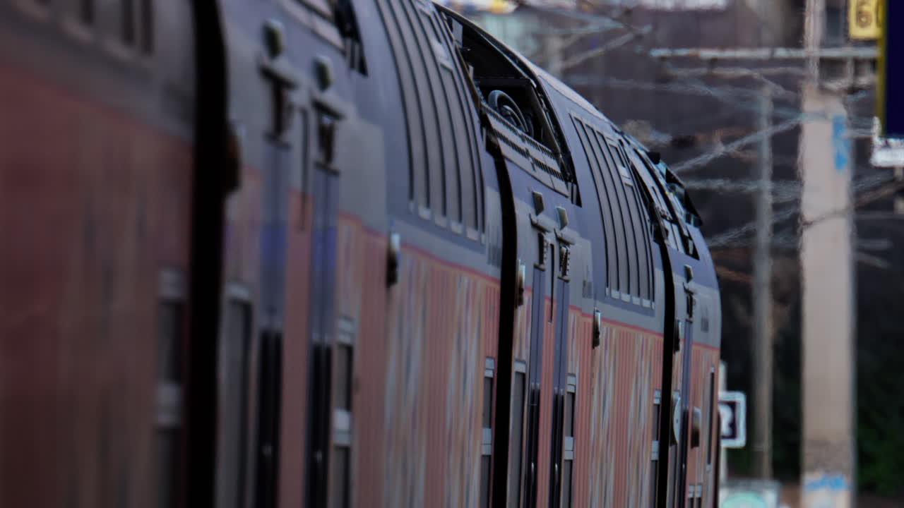 Nice, France - March 11, 2025: Close up of a grey train arriving at the station in daylight