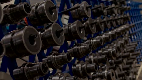 round metal parts hang in the factory floor, close-up. metal products of a metal processing plant.