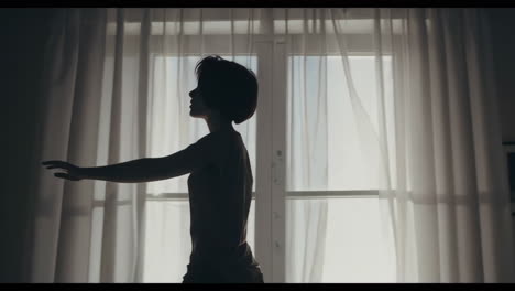 woman indoors by the window