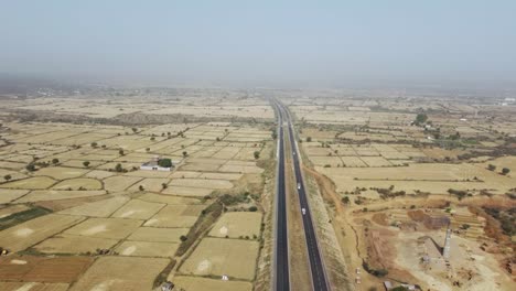 aerial drone shot of a highway road in central india , gwalior