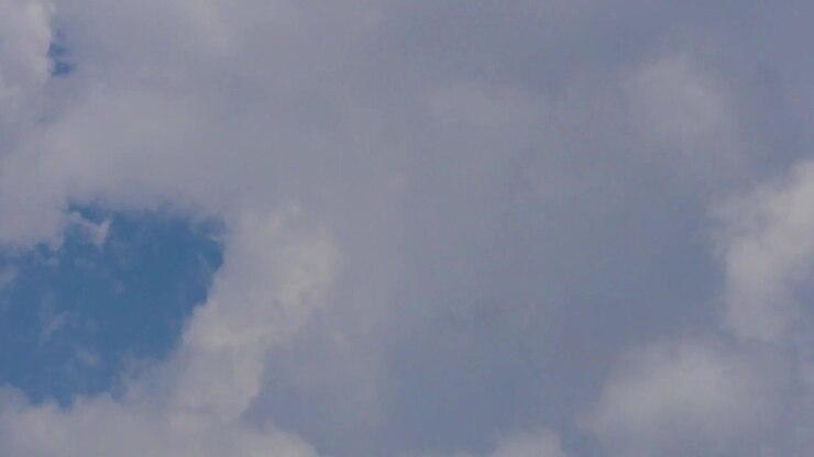 Timelapse of Thick Cumulous Clouds Forming and Dispersing against a Blue Sky, Close Up