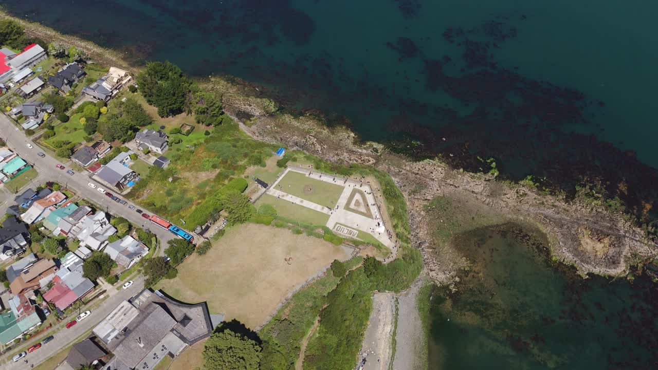 Aerial view of Fuerte San Antonio, a historical fort in Ancud, located on the coast of Chiloe Island, Chile, showing its unique coastal position