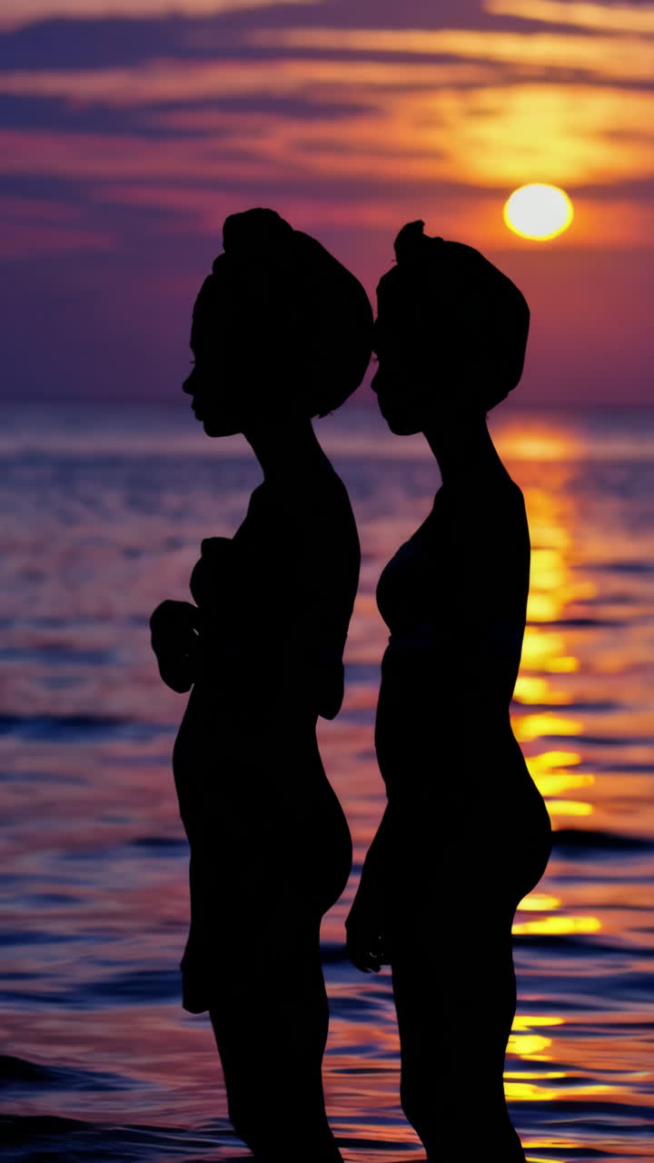 Silhouettes Against a Vibrant Ocean Sunset