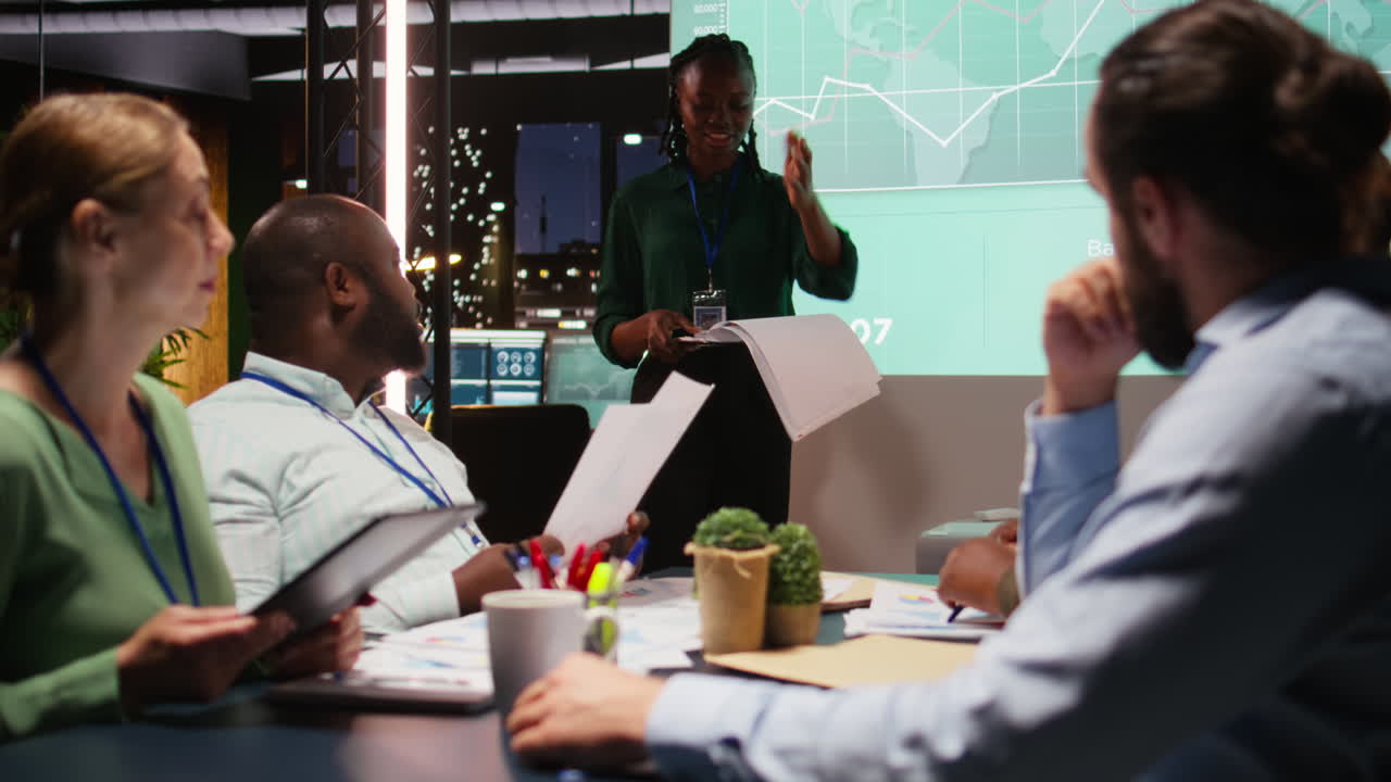 Business associates examining key performance indicators within the enterprise