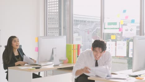 businessman throw papers into air for celebrating success at workplace after successful project