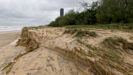 a series of frames showing beach erosion and storm impact on broadbeach, highlighting environmental changes and weather effects