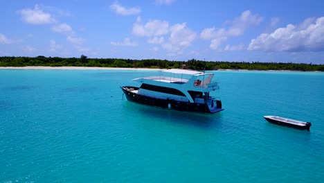 modern luxury yacht in clear turquoise waters, pan around in 4k