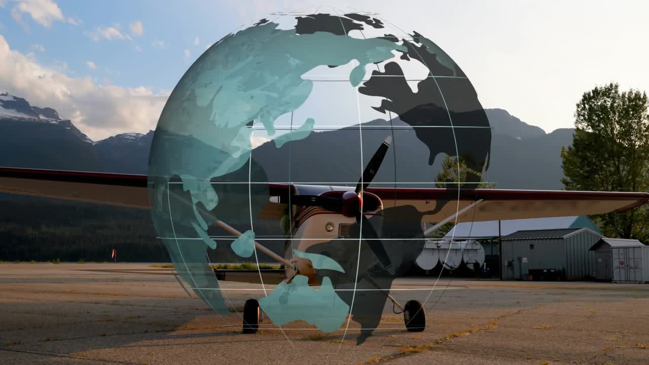 Propeller plane sitting on tarmac causing fading globe overlay rotating eastward revealing routes