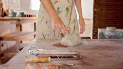 female potter with molded clay