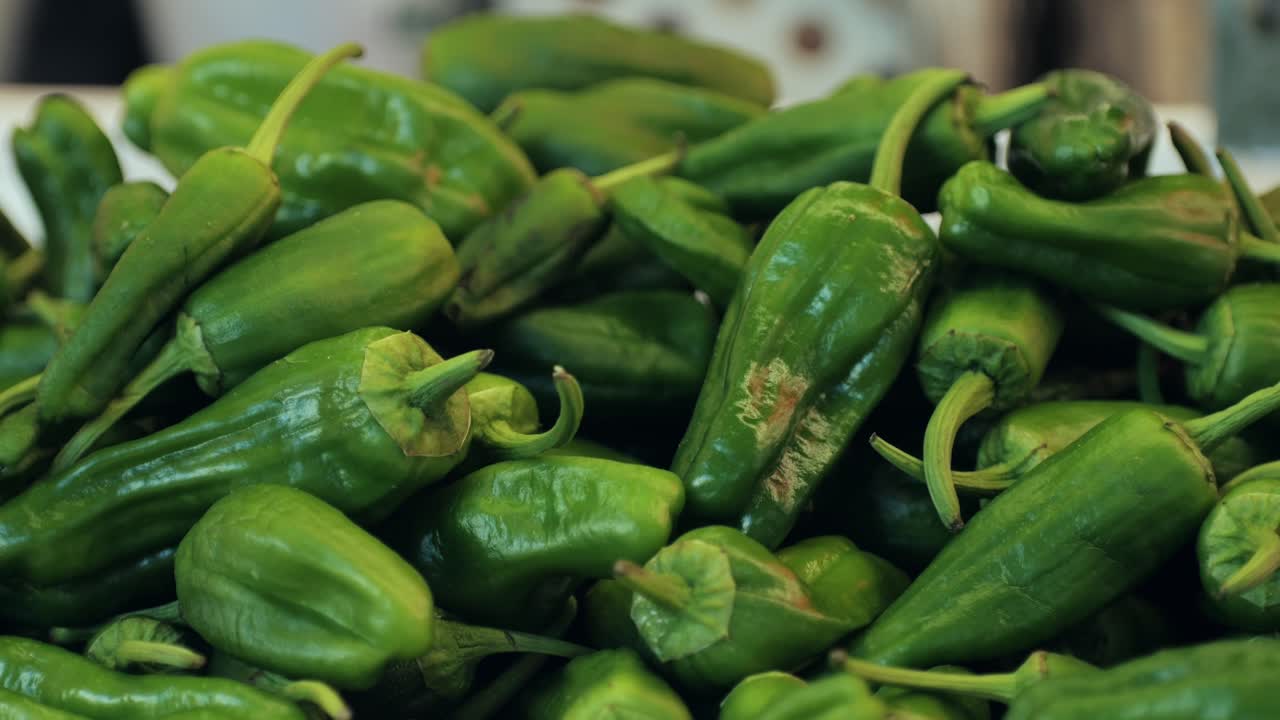 Closeup of fresh green jalapeno peppers, ideal for colorful food photography, emphasizing their freshness