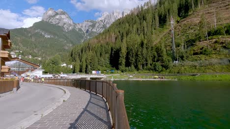 Tourists-walking-on-the-shores-of-Lake-Alleghe