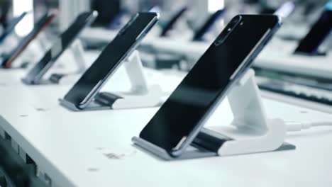 showcasing modern smartphones in a retail display: a sleek and stylish array of devices ready for purchase with a high-tech look
