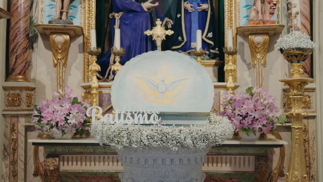 Holy baptismal font adorned with dove and vibrant flowers