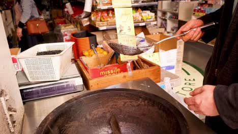 black beans being roasted in a large pan