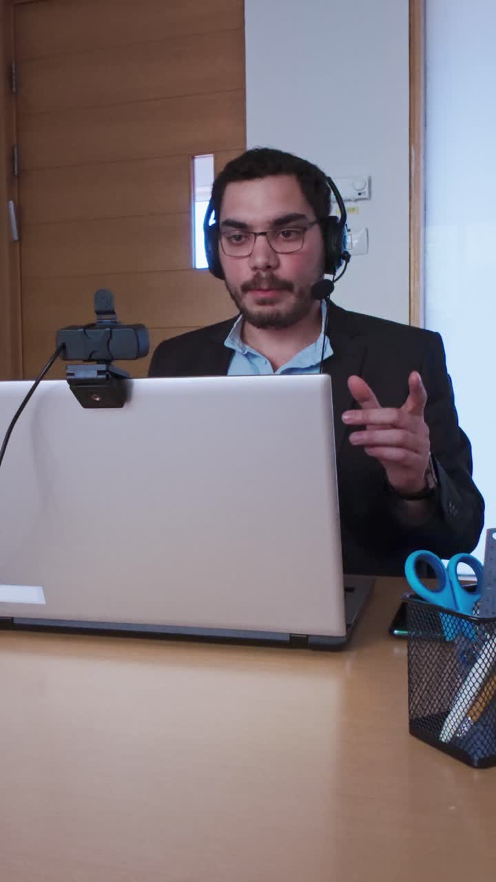 Man Giving a Thoughtful Explanation During an Online Seminar
