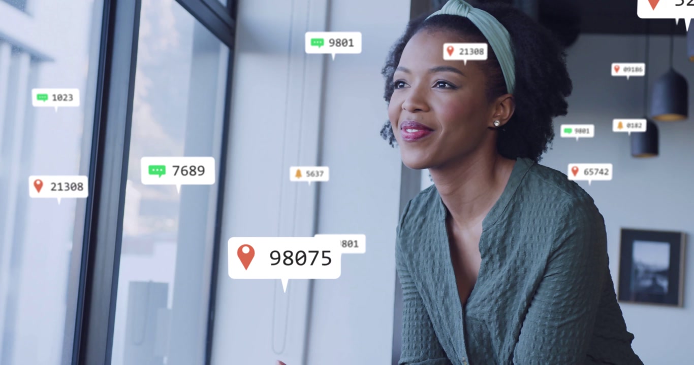 Female marketer sitting at window receiving phone notifications and monitoring chat badges for work