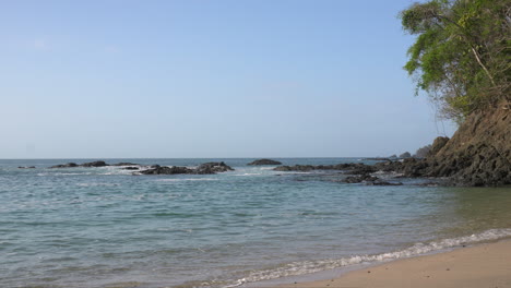 static shot of water crashing against rocks at a bay in cebaco island veraguas