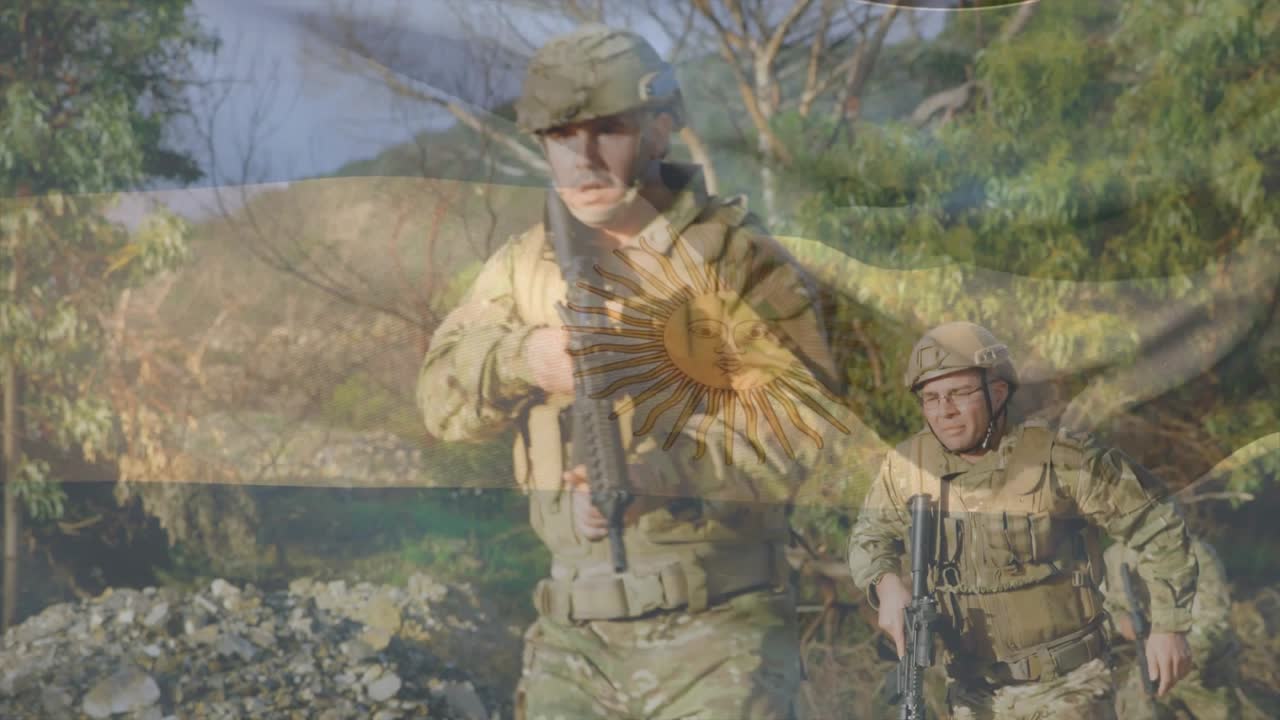 On command squad leader moving with rifles along military drill track, past tires, flag overlaying