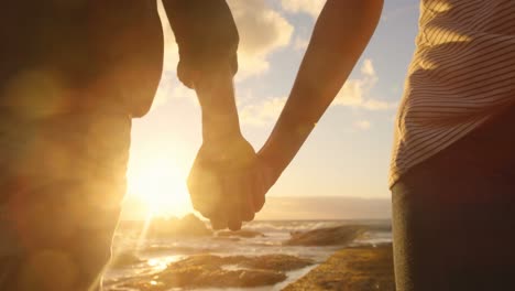 couple walking hand in hand on the beach 4k