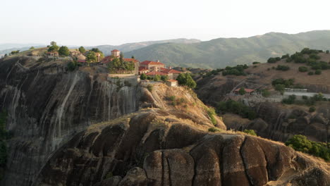 monastery perched atop a mountain in greece