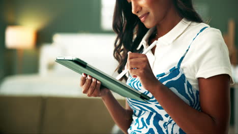 woman using digital tablet